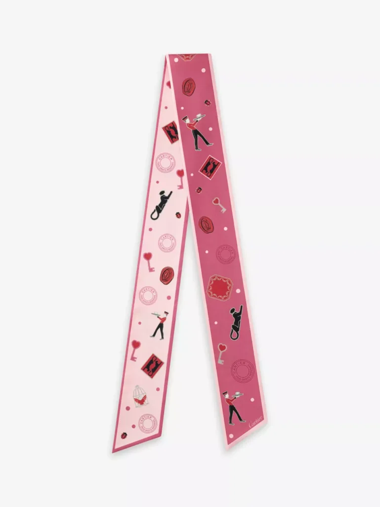 Pink silk Diabolo de Cartier twilly scarf featuring playful illustrations and luxury motifs