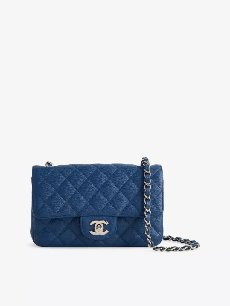 Pre-loved Chanel Mini Flap Bag in quilted blue leather with silver chain and CC logo clasp