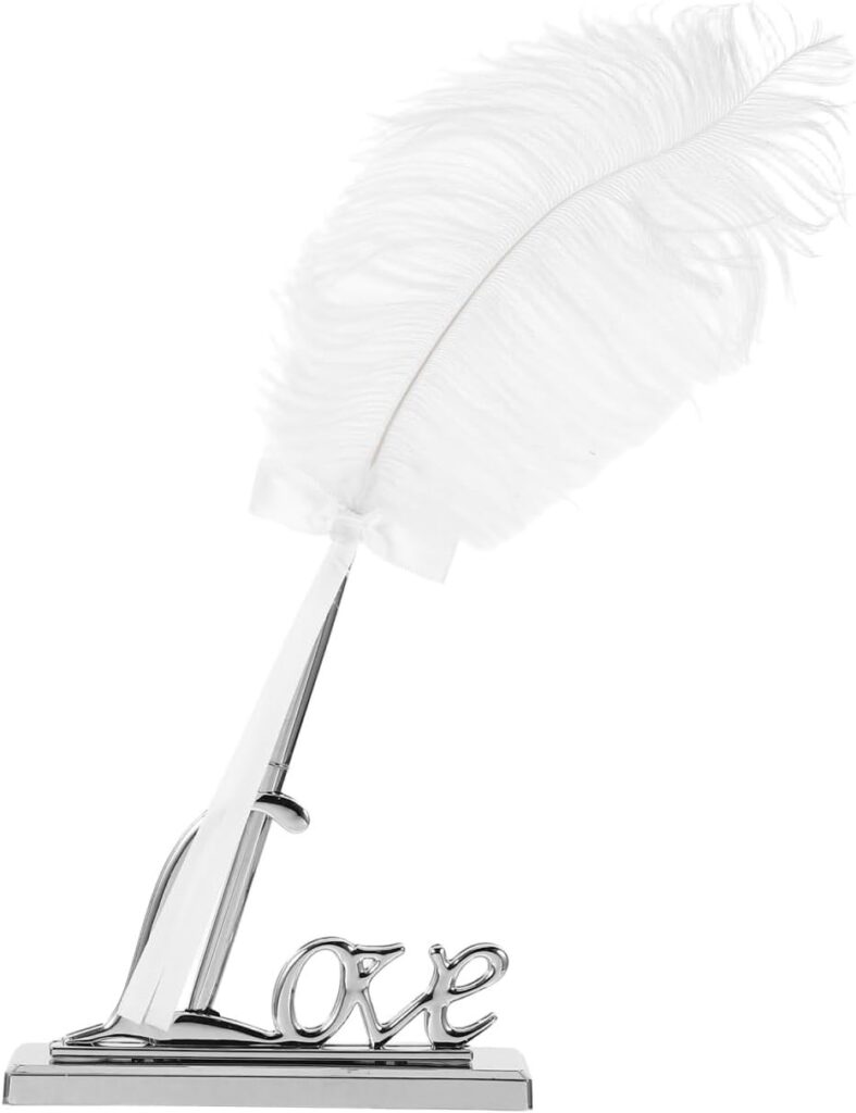 White feather quill pen with chrome “Love” base stand — elegant decorative writing tool for journaling or ceremonies.