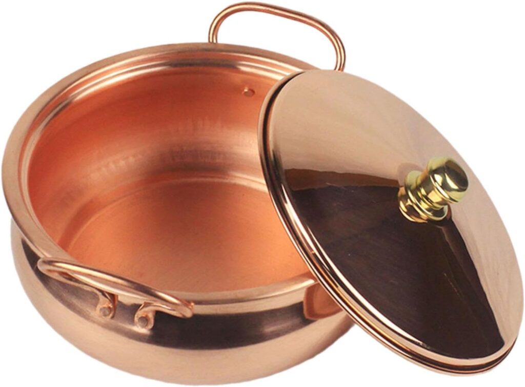 Open pure copper hot pot with lid and side handles, displayed against white background.