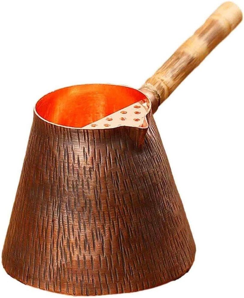Hand-hammered pure copper milk pot with natural wooden side handle and precision-pour spout.