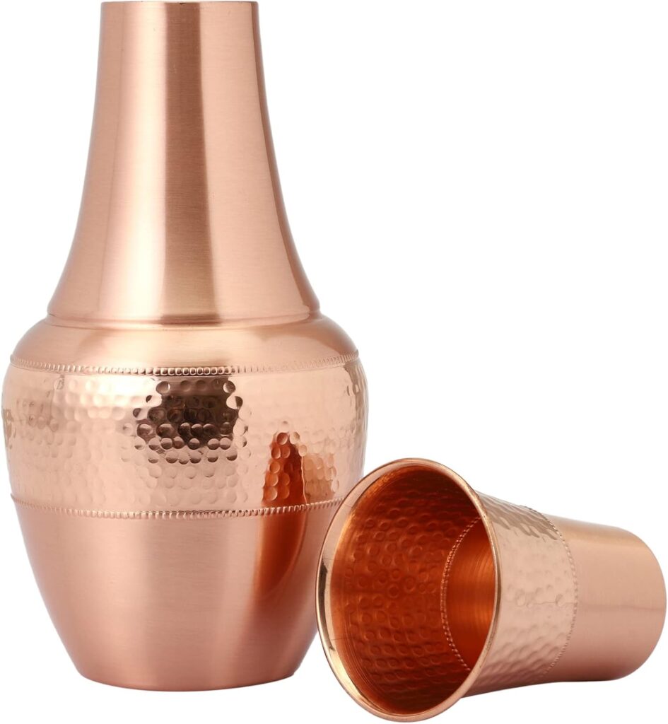 Pure copper hammered carafe and tumbler set with smooth upper body, ideal for bedside Ayurvedic rituals.