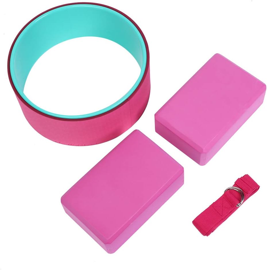 Pink yoga wheel with matching yoga blocks, strap, and resistance band for flexibility, back relief, and posture support.