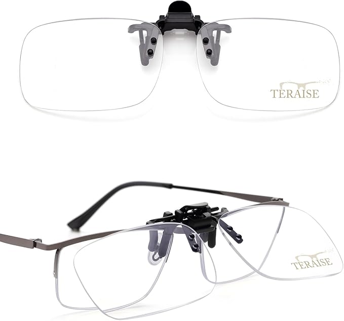 Clear TERAISE clip-on reading lenses with adjustable black nose bridge and hinge, designed to fit over standard glasses for enhanced clarity.