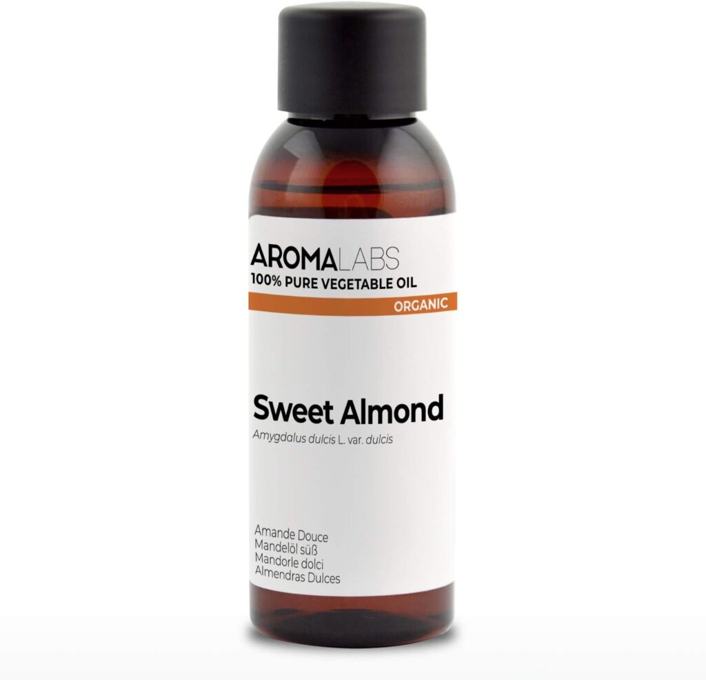 Aromalabs Organic Sweet Almond Oil in amber bottle with white minimalist label, 100% pure and cold-pressed.