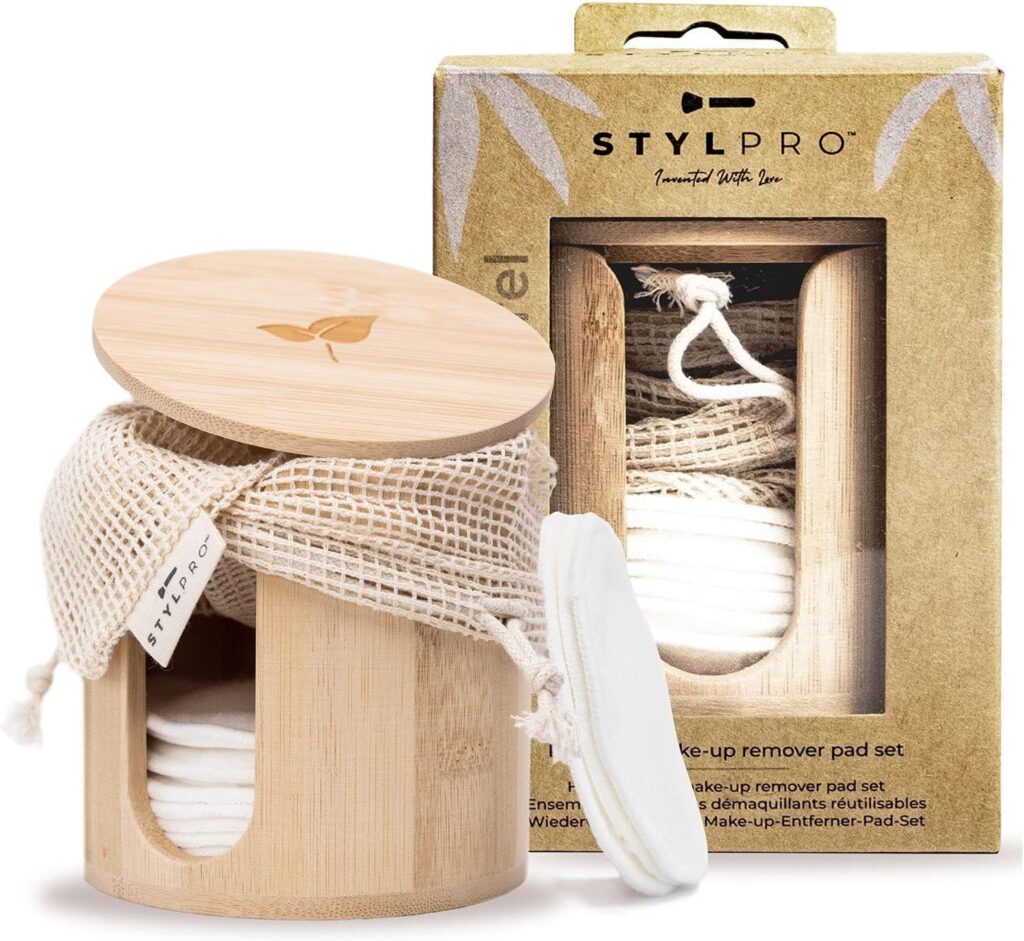 Bamboo container with reusable cotton makeup pads and mesh wash bag, next to branded STYLPRO packaging.