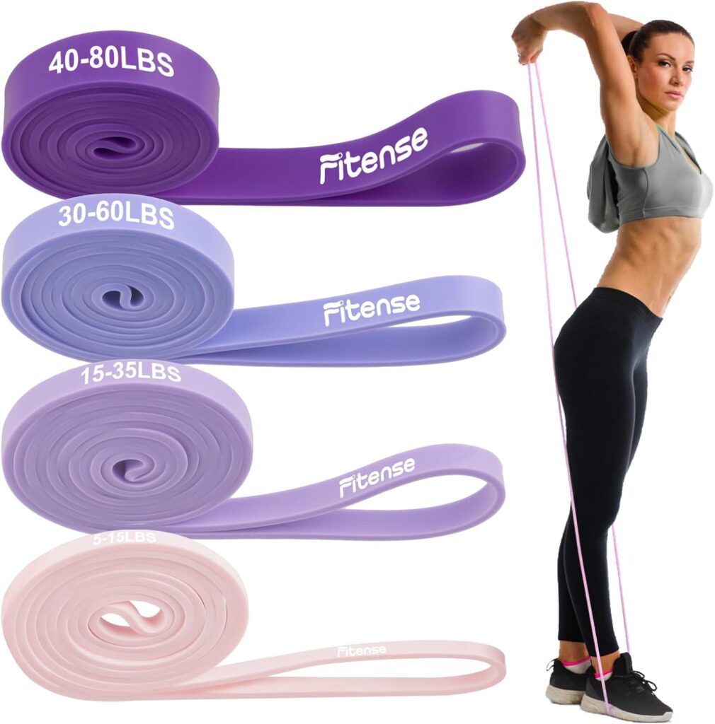 Set of four Fitense closed-loop resistance bands in shades of purple with a woman demonstrating upright pull movement