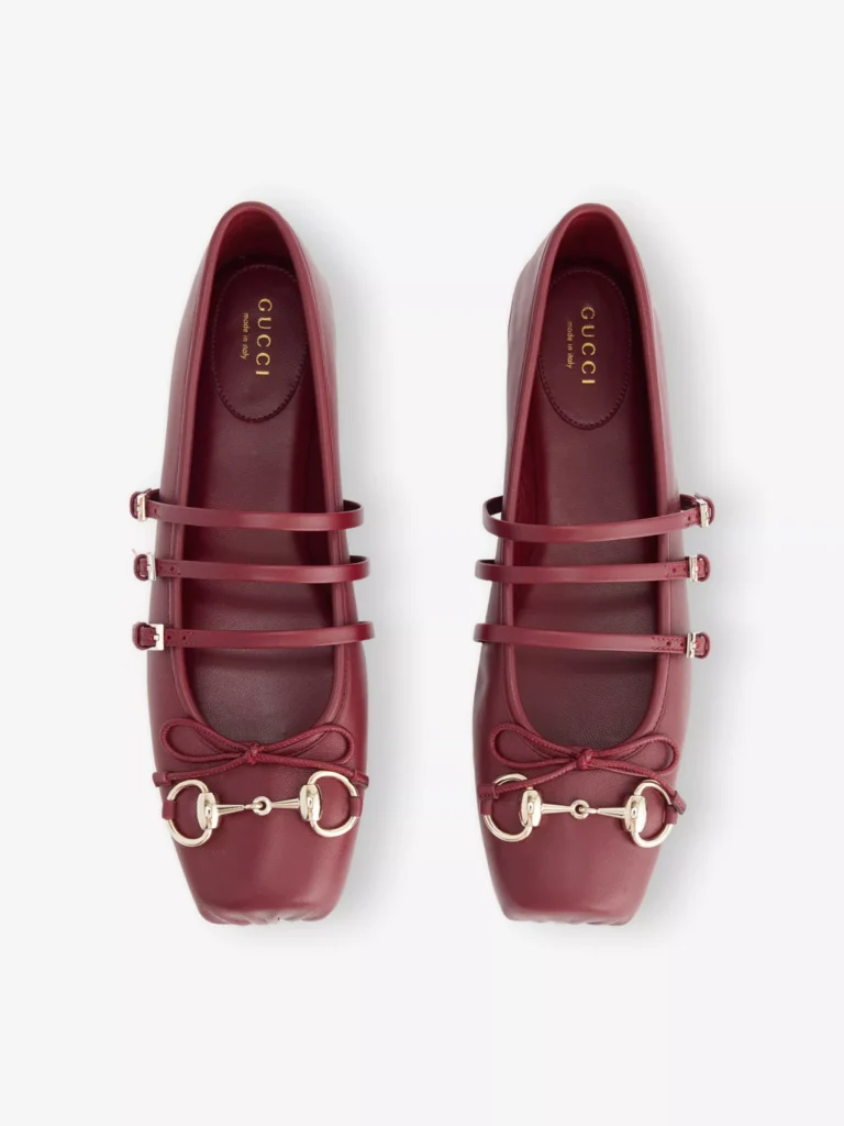 Burgundy Gucci Horsebit ballerina flats with triple straps and silver horsebit detail, photographed on a white background.