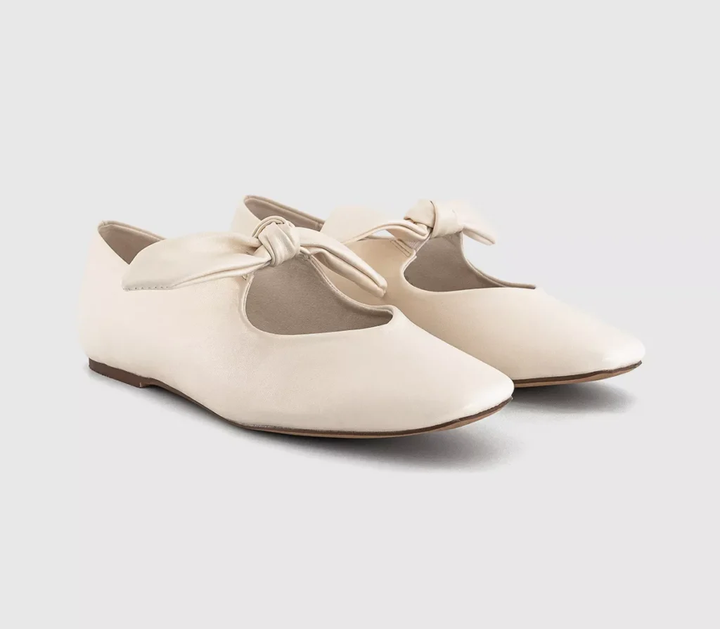 White Office Fliss ballerina flats with soft bow detail and rounded toe, displayed on a neutral background.